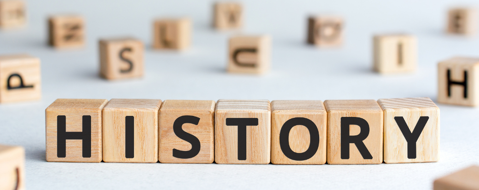 Wooden blocks with letters and 'HISTORY' for educational plumbing insights by Charles Krull & Son, Inc. Plumbing & Heating.