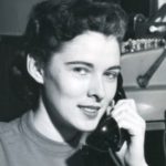 Vintage image of a woman with a classic telephone, reflecting Lillian Baumbach's pioneering spirit in plumbing.
