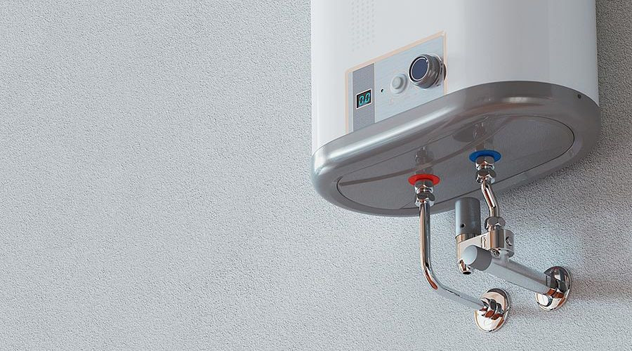 Tankless water heater mounted on wall with visible water inlet and outlet connections, showcasing modern plumbing technology relevant to home heating solutions.
